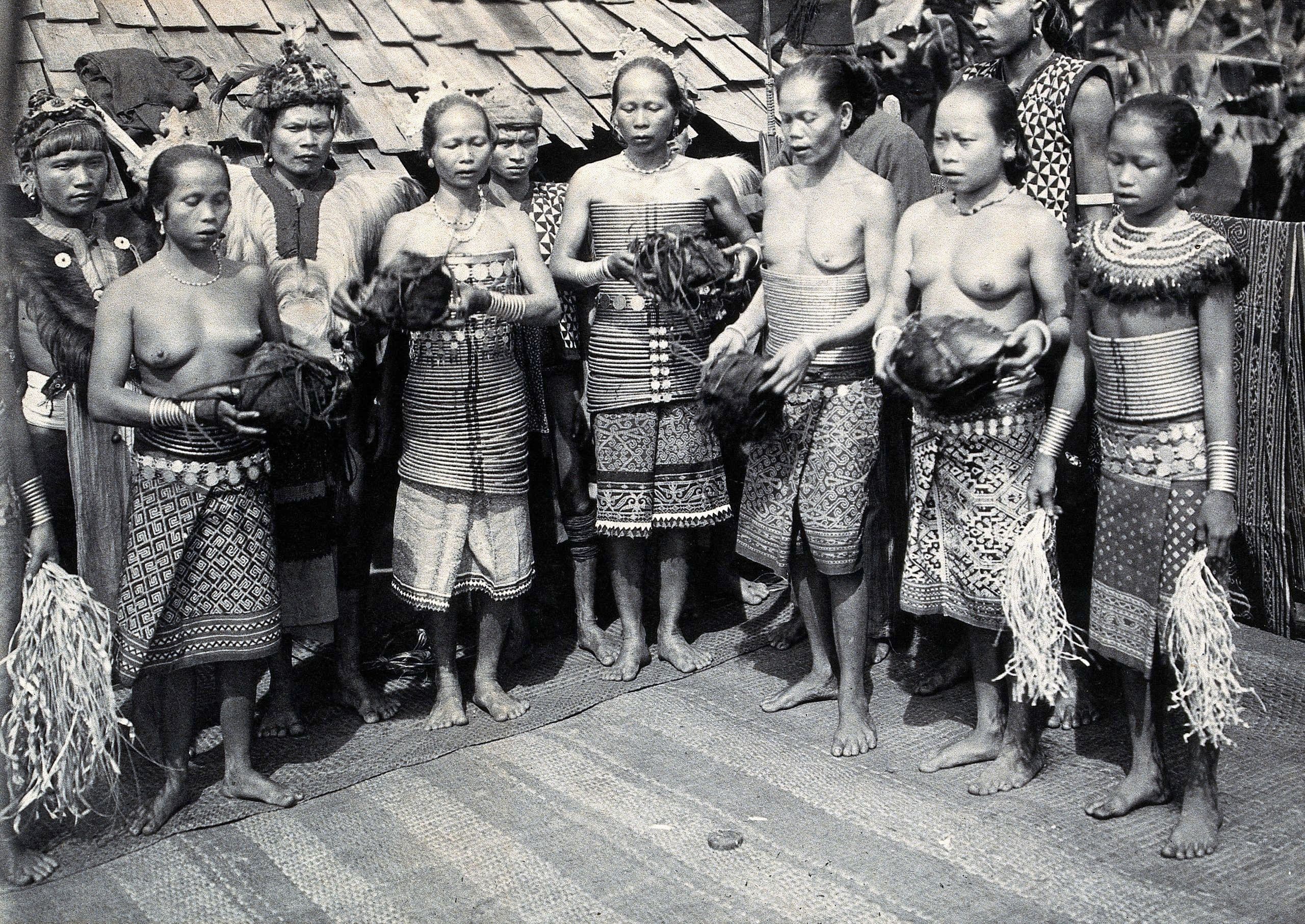 black and white image of a group of iban woman in their traditional attire